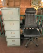 A metal four drawer filing cabinet,