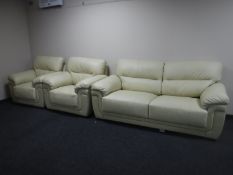 A three piece cream leather lounge suite