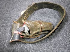 A 20th century tooled leather gun holster together with a replica long barrel .