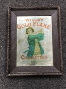 An early 20th century and later oak framed mirror bearing 