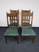 A set of four Arts & Crafts oak dining chairs