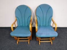 A pair of glider armchairs