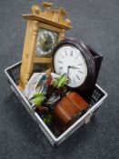 A box containing two quartz wall clocks, a cuckoo clock,
