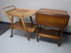 A mid twentieth century teak two tier trolley together with an oak barley twist trolley