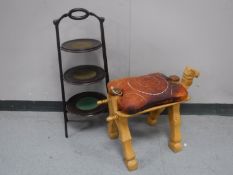 A Victorian mahogany three tier cake stand together with a camel stool