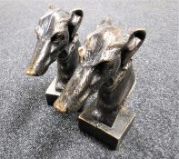 Two cast iron greyhound heads