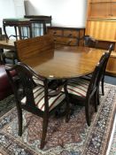 A Regency style twin pedestal table with leaf and six shield back chairs