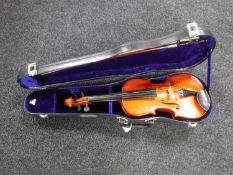 A 1/2 size Chinese violin and bow in hard case