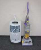 A Dyson DC 04 vacuum together with an air conditioning unit
