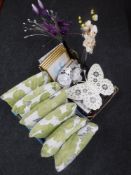 Two boxes of cushions, curtains, signed prints,