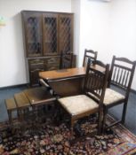 A six piece oak dining room suite and a nest of three oak tables