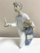 A Lladro figurine : Children in Nightshirts, model 4874, height 20 cm, boxed.
