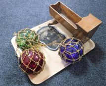 A tray of antique glass balls, miniature crib,