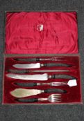 A cased late 19th century carving set by Joseph Rogers & Co,