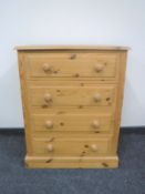 A pine four drawer chest