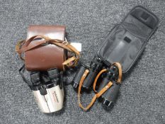 A pair of leather cased Herlanga 8X30 field glasses together with a pair of Sunagor mini zoom