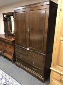A nineteenth century oak double door linen press fitted with four drawers, width 125 cm.