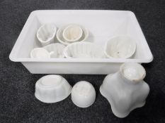 A box of antique ceramic pie moulds