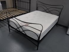 A 4'6 contemporary metal bed frame together with a Balmoral Ortho care memory foam mattress