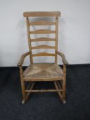 A pine farmhouse rocking chair