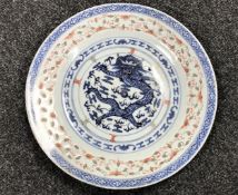A Chinese celadon glazed porcelain plate depicting a five-clawed dragon,
