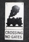 A cast iron level crossing train plaque