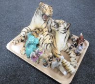 A tray containing a large china figure of fighting tigers together with two Melba ware terriers,