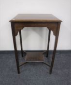 An Edwardian oak occasional table