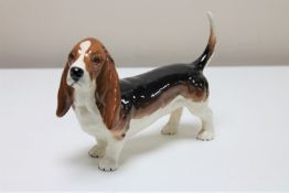A Beswick china figure - Bassett hound, gloss, height 12 cm, model 2045A.