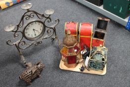 A tray of three hand painted wooden wine bottle holders,