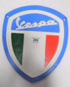 A cast iron Vespa scooter wall plaque