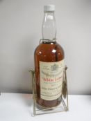 A 1 gallon bottle of Dewar's White Label Whisky on stand