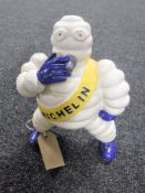 A cast iron Michelin figure smoking