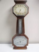 A mahogany barometer with silvered dial,