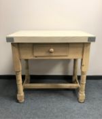 A reclaimed pine butcher's block fitted with a drawer,