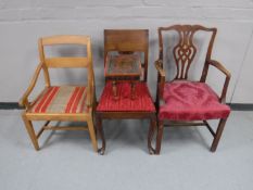 A pine armchair together with a mahogany armchair,