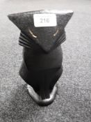 A cast iron cat doorstop