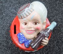 A cast iron bottle cap bank - Coca Cola