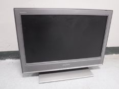 A Sony Bravia 26 inch LCD TV with remote