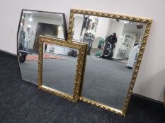 Two gilt framed bevelled edge mirrors together with another early 20th century bevelled mirror