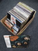 A box of LP's, pop and rock, The Beatles, Cream etc and a small quantity of 7 inch vinyl.