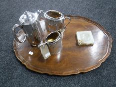 A mahogany scalloped edge serving tray together with a three-piece Walker & Hall plated tea service