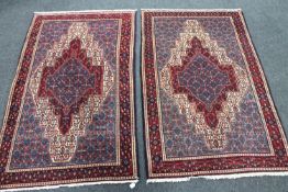 A pair of Tabriz design rugs