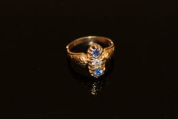 An 18ct gold sapphire and diamond three stone ring