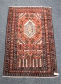 An old Baluchi rug 134 cm x 86 cm