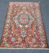 An antique Persian Bakhtiari rug 196 cm x 132 cm