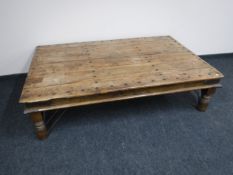 A large rustic pine rectangular coffee table