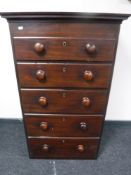 A Victorian mahogany five drawer chest with knob handles