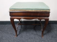 A late Victorian mahogany piano stool
