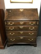 A George III oak bureau, width 76 cm.